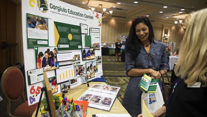 Rocio Elisa laughs while talking with Bobbie Mayhood, of the Gargiulo Education Center, during the Get Involved Collier! 2016 Volunteer Expo at the Hilton Hotel in Naples on Wednesday, Nov. 2, 2016. Over 50 local nonprofit organizations in Collier County that have volunteer needs attended the event and networked with volunteers.